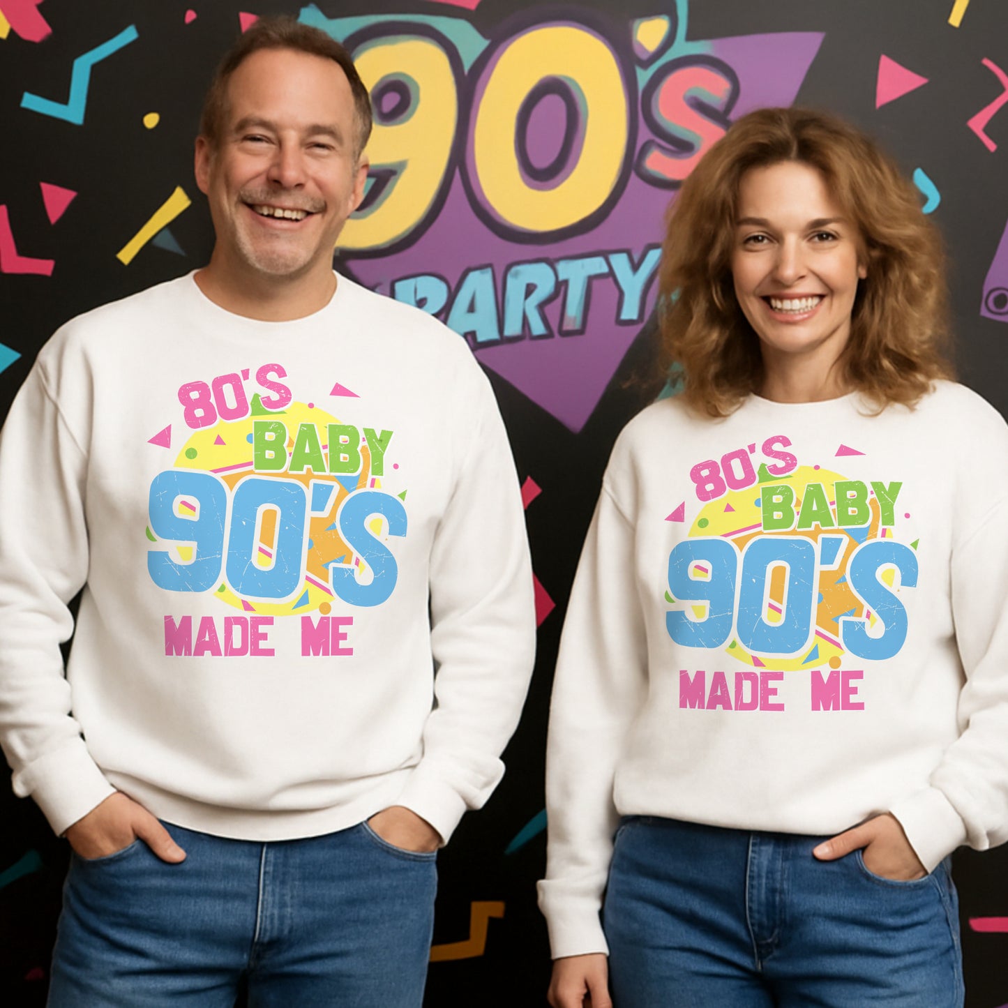 Two people wearing '80s Baby 90s Made Me' sweatshirts in front of a colorful '90s Party' backdrop.