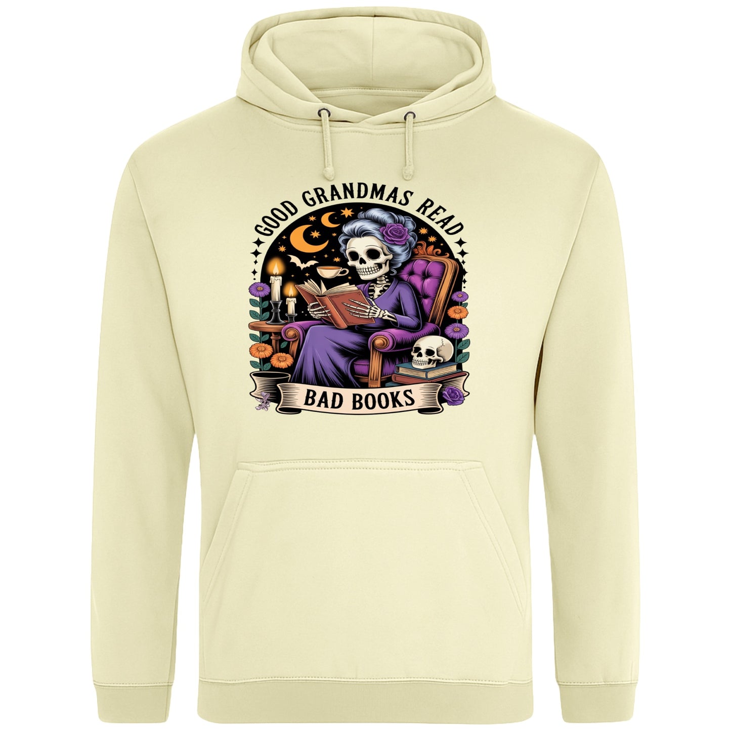 Cosy vanilla milkshake colour hoodie with a spooky-cute skeleton grandma reading a “bad” book under moonlight – the perfect mix of bookish and gothic vibes.