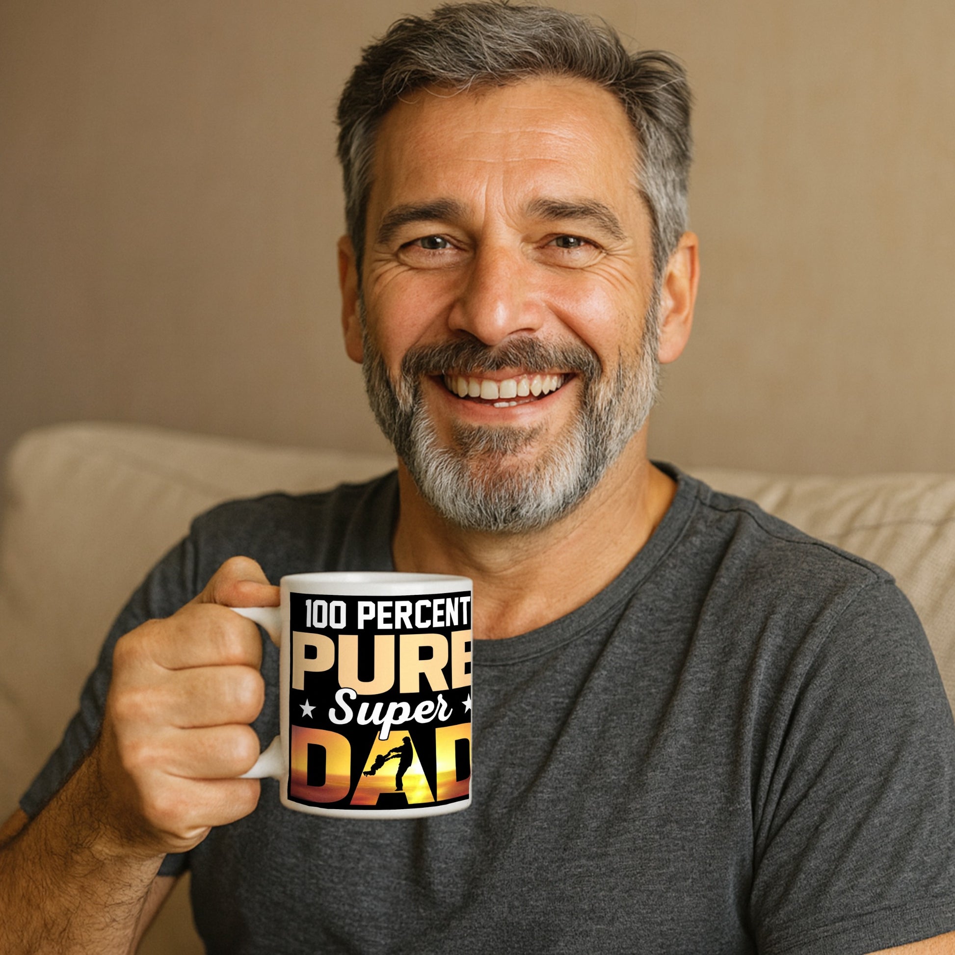Man holding a mug with the words ‘100 Percent Pure Super Dad’ and a silhouette of a dad swinging his child at sunset – the perfect gift for the hero in your life.