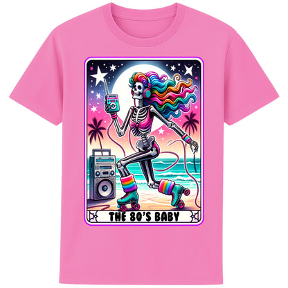 A pink 80s Baby retro graphic T-shirt featuring a colourful neon skeleton on roller skates with rainbow hair, vintage headphones, cassette player, boombox, and sunset background, perfect for 80s nostalgia lovers and retro fashion.