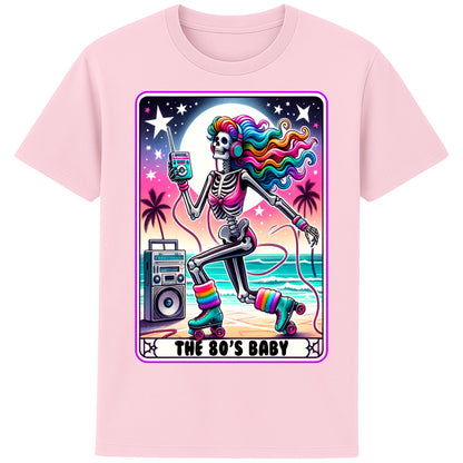 A pink 80s Baby retro graphic T-shirt featuring a colourful neon skeleton on roller skates with rainbow hair, vintage headphones, cassette player, boombox, and sunset background, perfect for 80s nostalgia lovers and retro fashion.