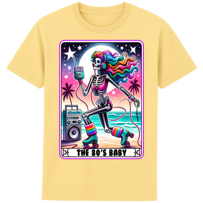 A yellow 80s Baby retro graphic T-shirt featuring a colourful neon skeleton on roller skates with rainbow hair, vintage headphones, cassette player, boombox, and sunset background, perfect for 80s nostalgia lovers and retro fashion.
