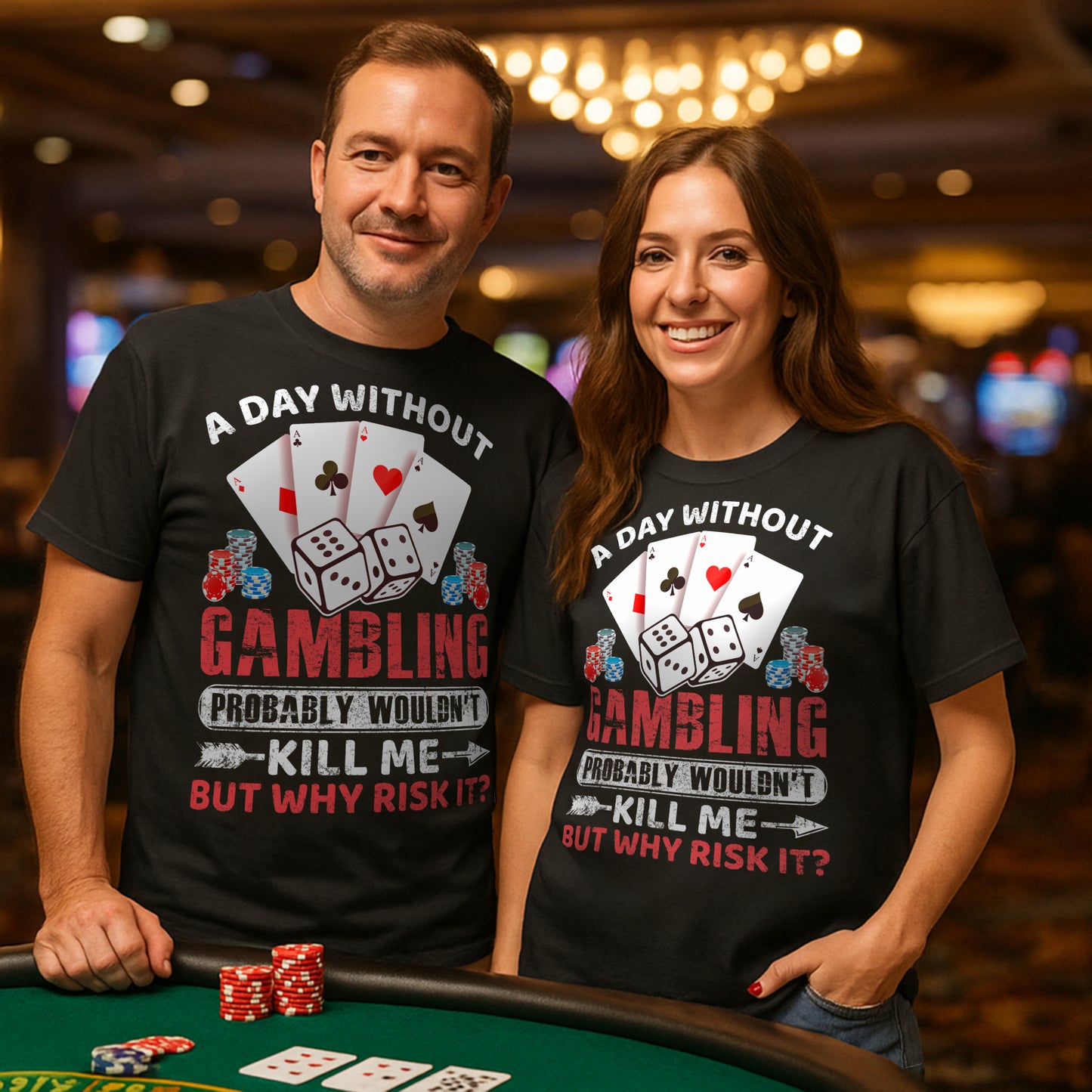 Two people wearing black poker and casino t-shirts featuring playing cards, poker chips, dice, and the slogan "A Day Without Gambling Probably Wouldn't Kill Me... But Why Risk It?" beside a casino gaming table.