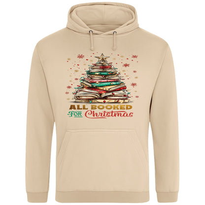 Nude All Booked For Christmas hoodie featuring a Christmas tree made from stacked books with festive lights and a golden star, a cosy Christmas book lover hoodie for readers, bookworms, librarians, and holiday reading.