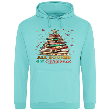 Peppermint All Booked For Christmas hoodie featuring a Christmas tree made from stacked books with festive lights and a golden star, a cosy Christmas book lover hoodie for readers, bookworms, librarians, and holiday reading.