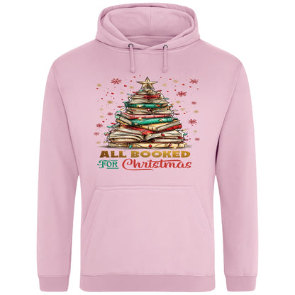 Pink All Booked For Christmas hoodie featuring a Christmas tree made from stacked books with festive lights and a golden star, a cosy Christmas book lover hoodie for readers, bookworms, librarians, and holiday reading.