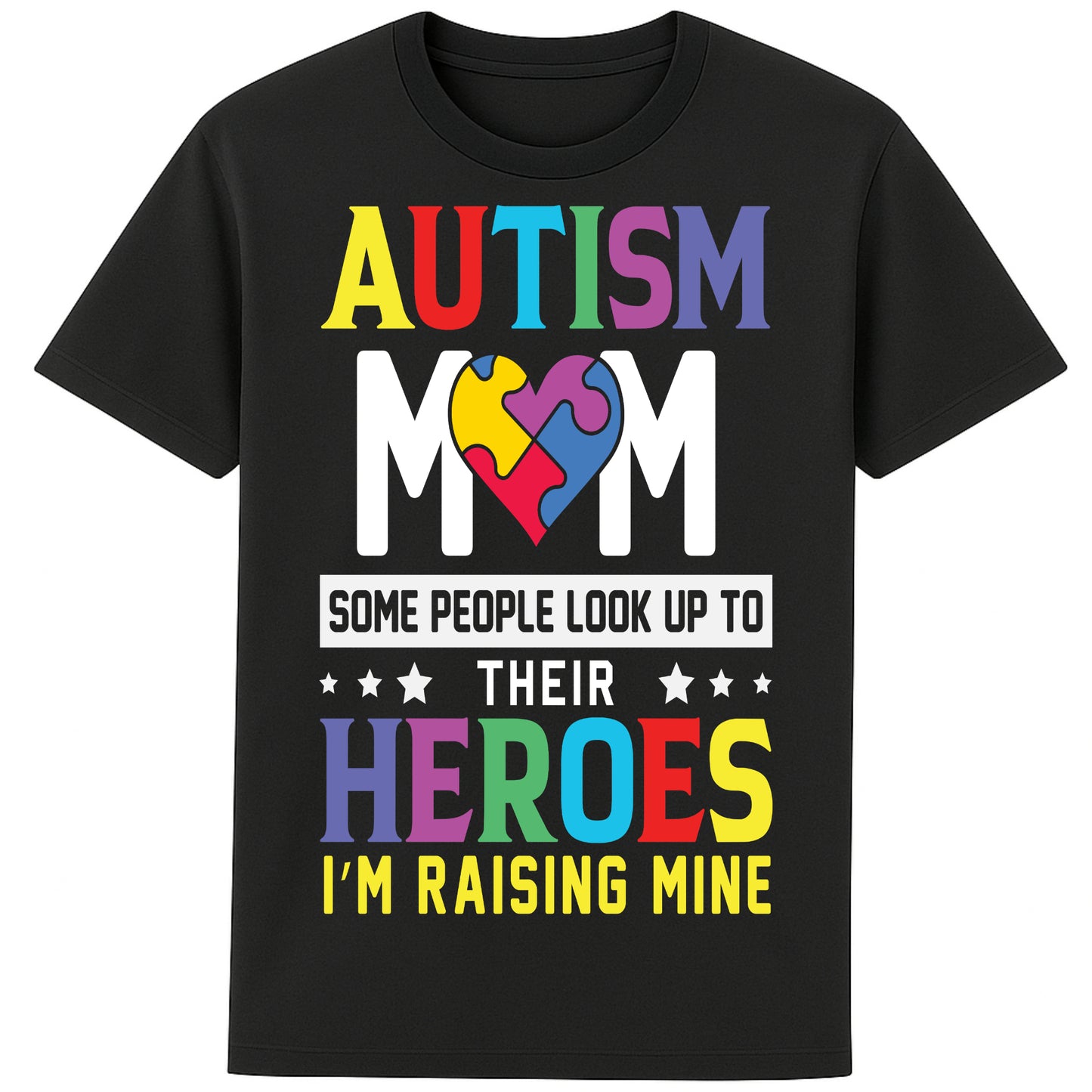 A black t-shirt with bold, colorful text reading: "AUTISM MOM" at the top, each letter in a different color. Below it, a heart-shaped puzzle piece design in multiple vibrant colors. Underneath, the text says: "SOME PEOPLE LOOK UP TO THEIR HEROES I'M RAISING MINE," with "HEROES" emphasized in large, colorful letters. The design celebrates motherhood and pride in raising a child with autism.
