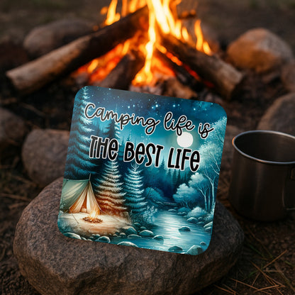 Camping Life Is The Best Life coaster displayed on a rock beside a glowing campfire and camping mug, perfect for campers, caravans, campervans, RVs, and outdoor lovers.