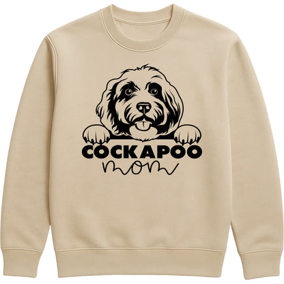 Nude colour sweatshirt with "Cockapoo Mom" text and a cute Cockapoo face graphic, perfect for dog moms and pet lovers.
