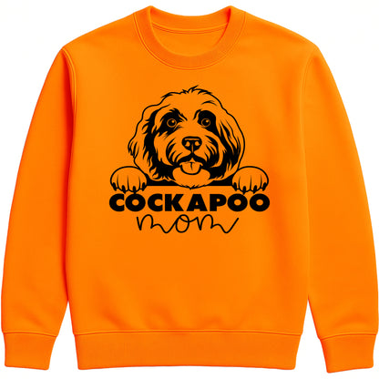 orange crush colour sweatshirt with "Cockapoo Mom" text and a cute Cockapoo face graphic, perfect for dog moms and pet lovers.