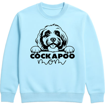 Sky Blue sweatshirt with "Cockapoo Mom" text and a cute Cockapoo face graphic, perfect for dog moms and pet lovers.