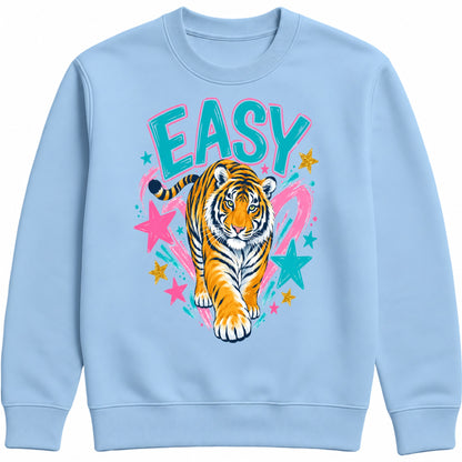 A light blue easy tiger crewneck sweatshirt featuring a colorful graphic of a walking tiger with the word 'EASY' in teal letters, surrounded by pink and teal stars