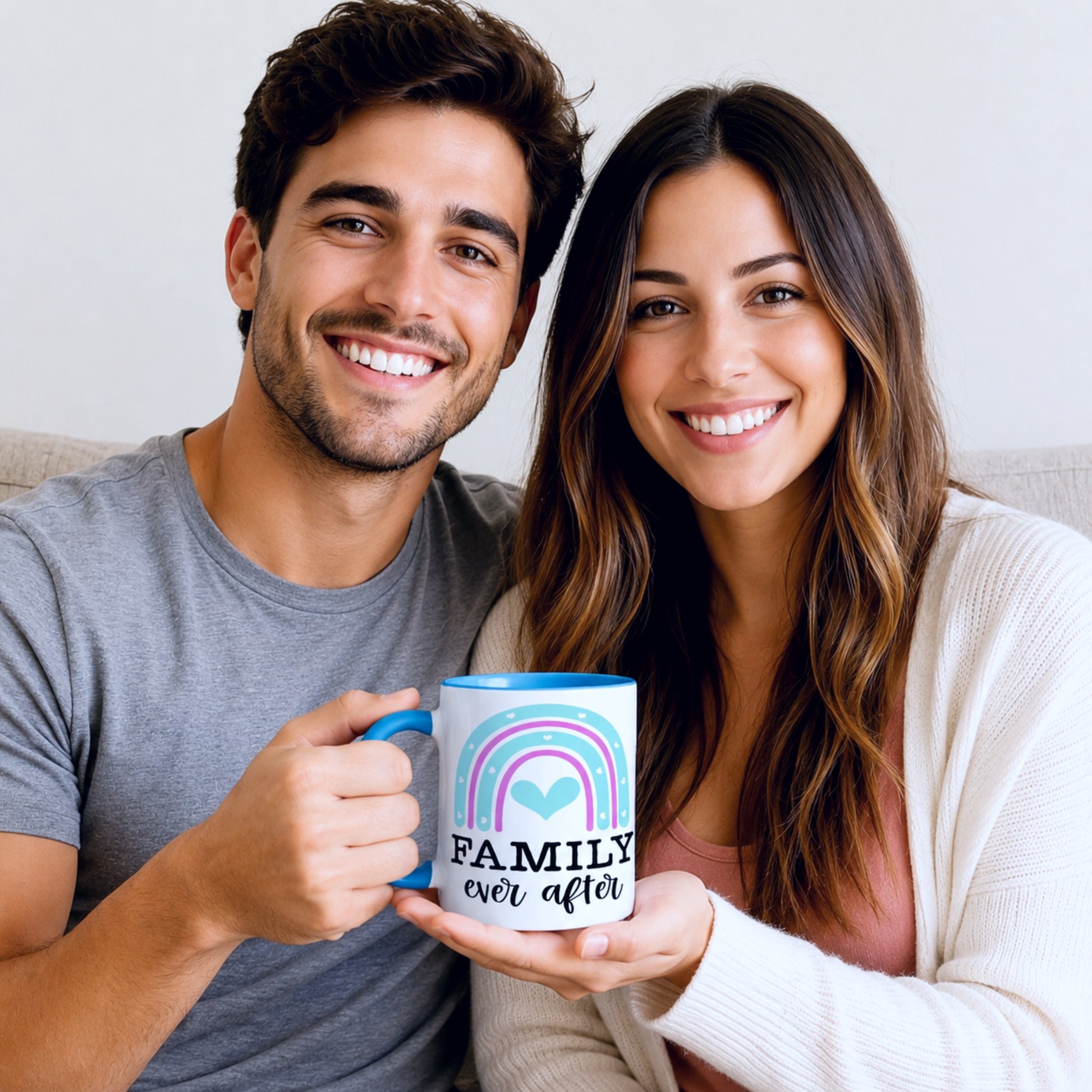 Smiling couple holding a Family Ever After coffee mug featuring a colourful rainbow heart design, lifestyle mockup showcasing a meaningful family gift and ceramic coffee mug.