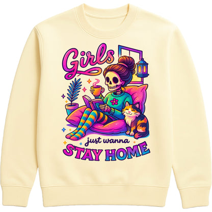 Vanilla milkshake colour Girls Just Wanna Stay Home Sweatshirt featuring a colourful skeleton relaxing on a cosy sofa with a coffee, book, cat, lantern, and houseplants, funny homebody sweatshirt for introverts, book lovers, and cat lovers.