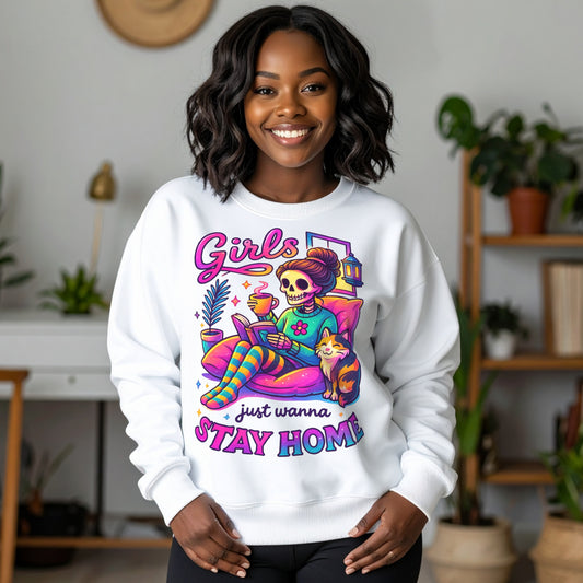 Woman wearing the Girls Just Wanna Stay Home Sweatshirt featuring a colourful skeleton relaxing with a coffee, book, cat, lantern, and houseplants, a funny homebody sweatshirt for introverts, book lovers, and cat lovers.