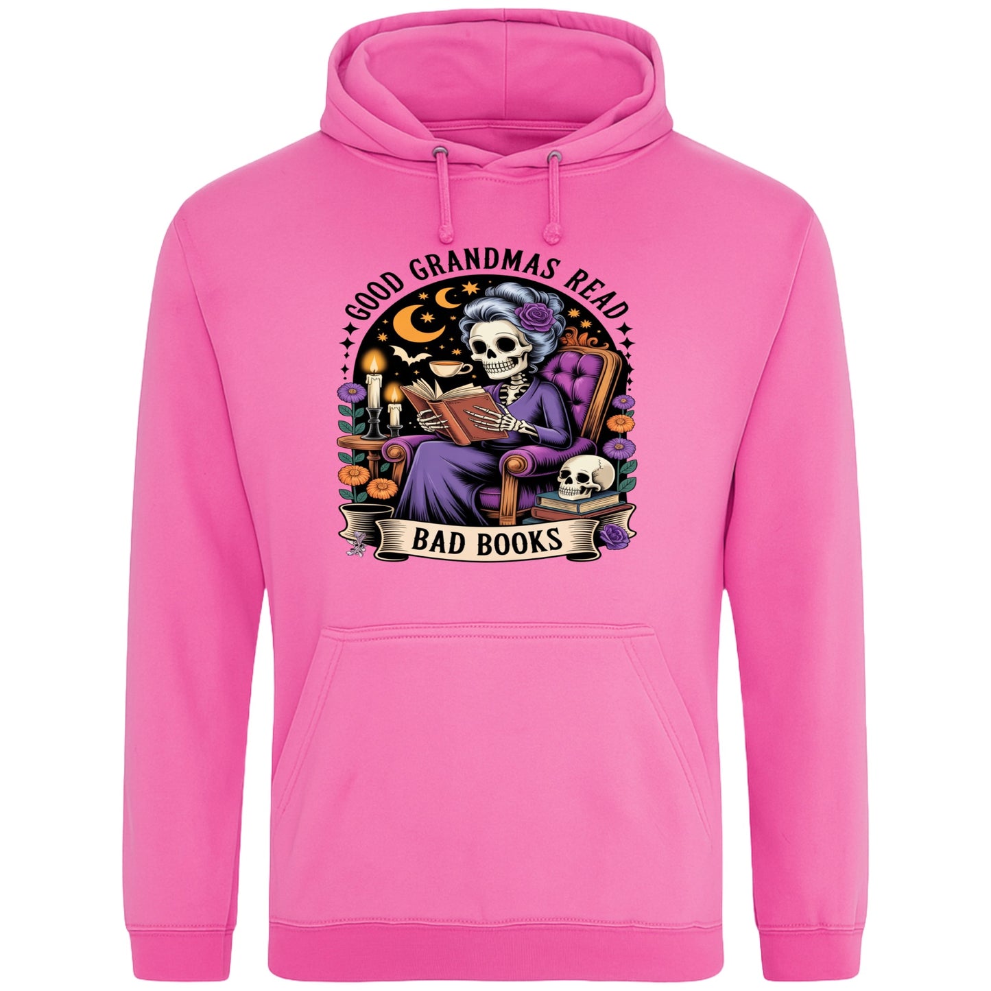 Pink Good Grandmas Read Bad Books Hoodie featuring a spooky cute skeleton grandma reading in a cosy armchair with candles and flowers, funny grandma hoodie for book lovers and gothic readers.