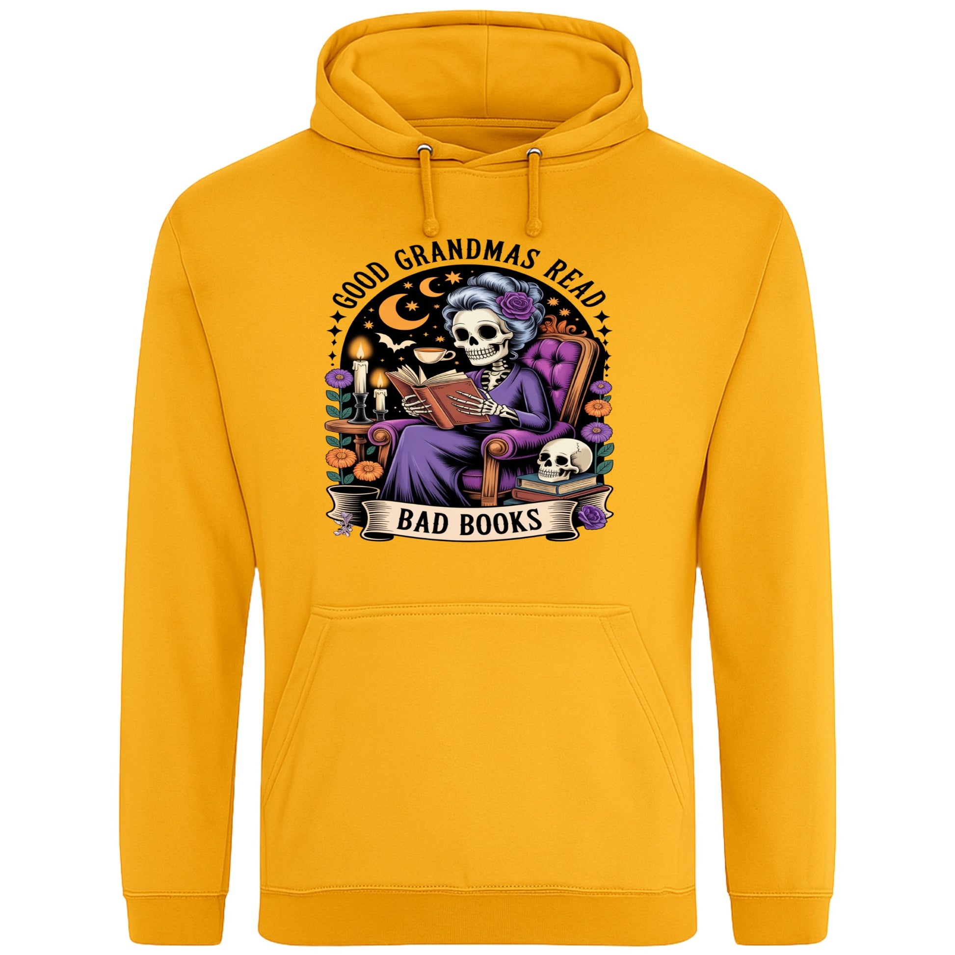 Gold colour Good Grandmas Read Bad Books Hoodie featuring a spooky cute skeleton grandma reading in a cosy armchair with candles and flowers, funny grandma hoodie for book lovers and gothic readers.