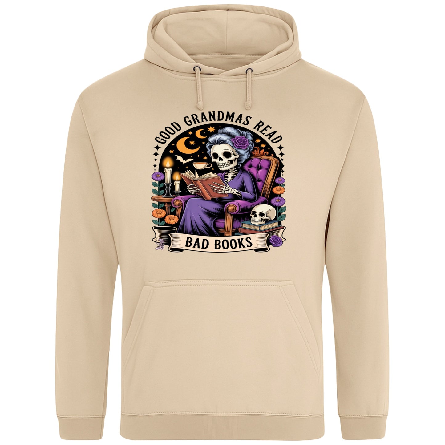 Nude colour Good Grandmas Read Bad Books Hoodie featuring a spooky cute skeleton grandma reading in a cosy armchair with candles and flowers, funny grandma hoodie for book lovers and gothic readers.