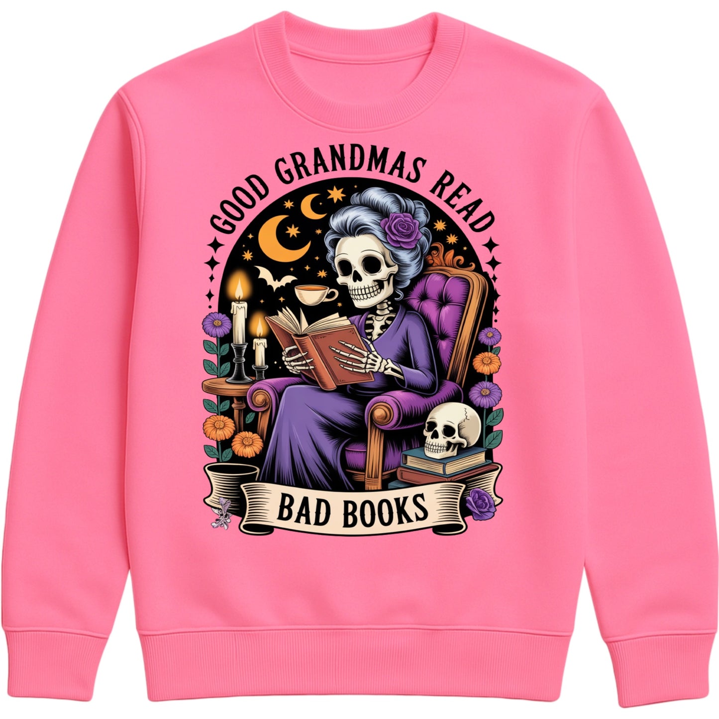 Candyfloss pink Good Grandmas Read Bad Books Sweatshirt featuring a spooky cute skeleton grandma reading in a cosy armchair with candles, flowers, and moon details, funny grandma sweatshirt for book lovers and gothic book lovers.