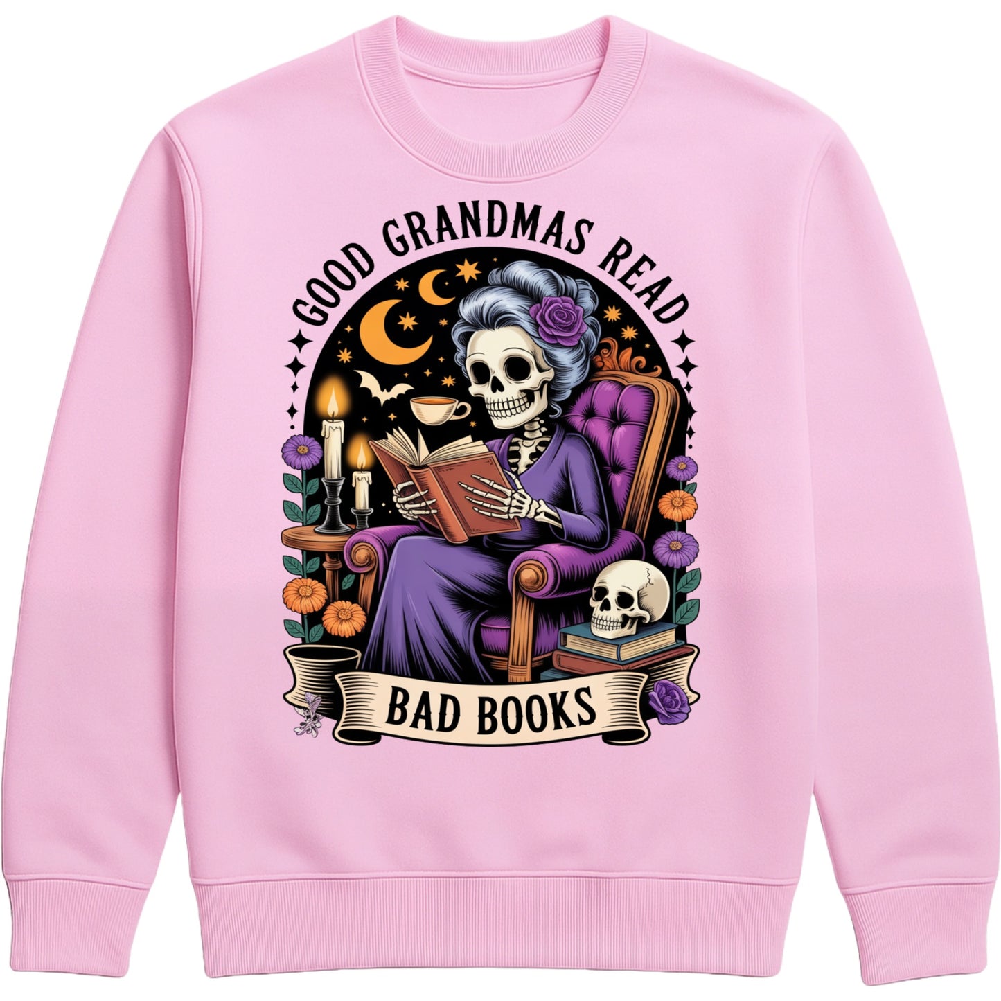Pink Good Grandmas Read Bad Books Sweatshirt featuring a spooky cute skeleton grandma reading in a cosy armchair with candles, flowers, and moon details, funny grandma sweatshirt for book lovers and gothic book lovers.