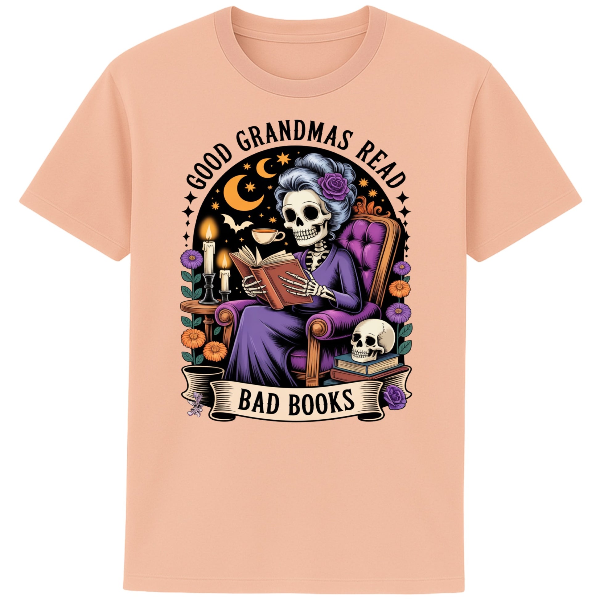 Fraiche peche colour Good Grandmas Read Bad Books T-Shirt featuring a spooky cute skeleton grandma reading in a cosy armchair with candles and flowers, funny grandma t shirt for book lovers and gothic book lovers.