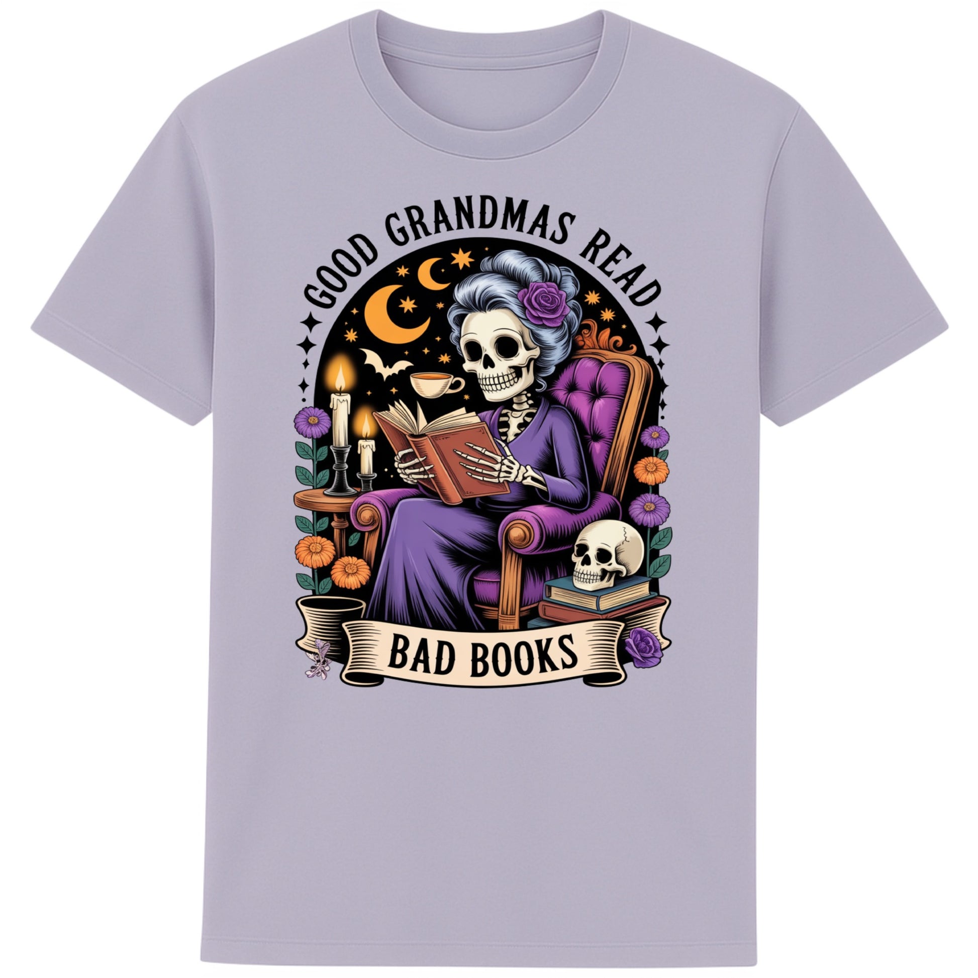 Lavender colour Good Grandmas Read Bad Books T-Shirt featuring a spooky cute skeleton grandma reading in a cosy armchair with candles and flowers, funny grandma t shirt for book lovers and gothic book lovers.