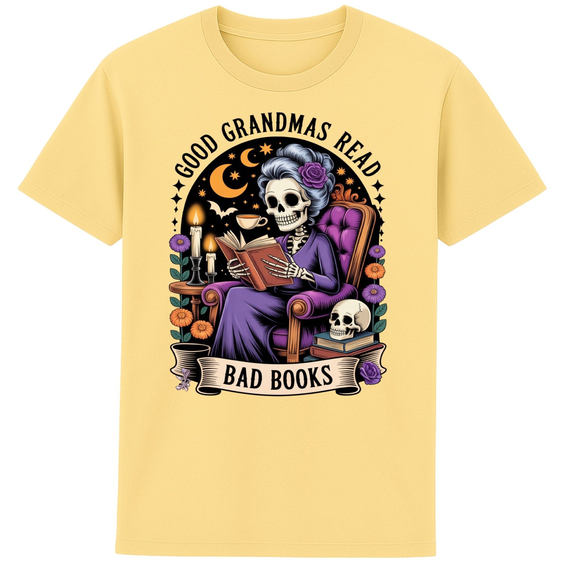 Yellow Good Grandmas Read Bad Books T-Shirt featuring a spooky cute skeleton grandma reading in a cosy armchair with candles and flowers, funny grandma t shirt for book lovers and gothic book lovers.