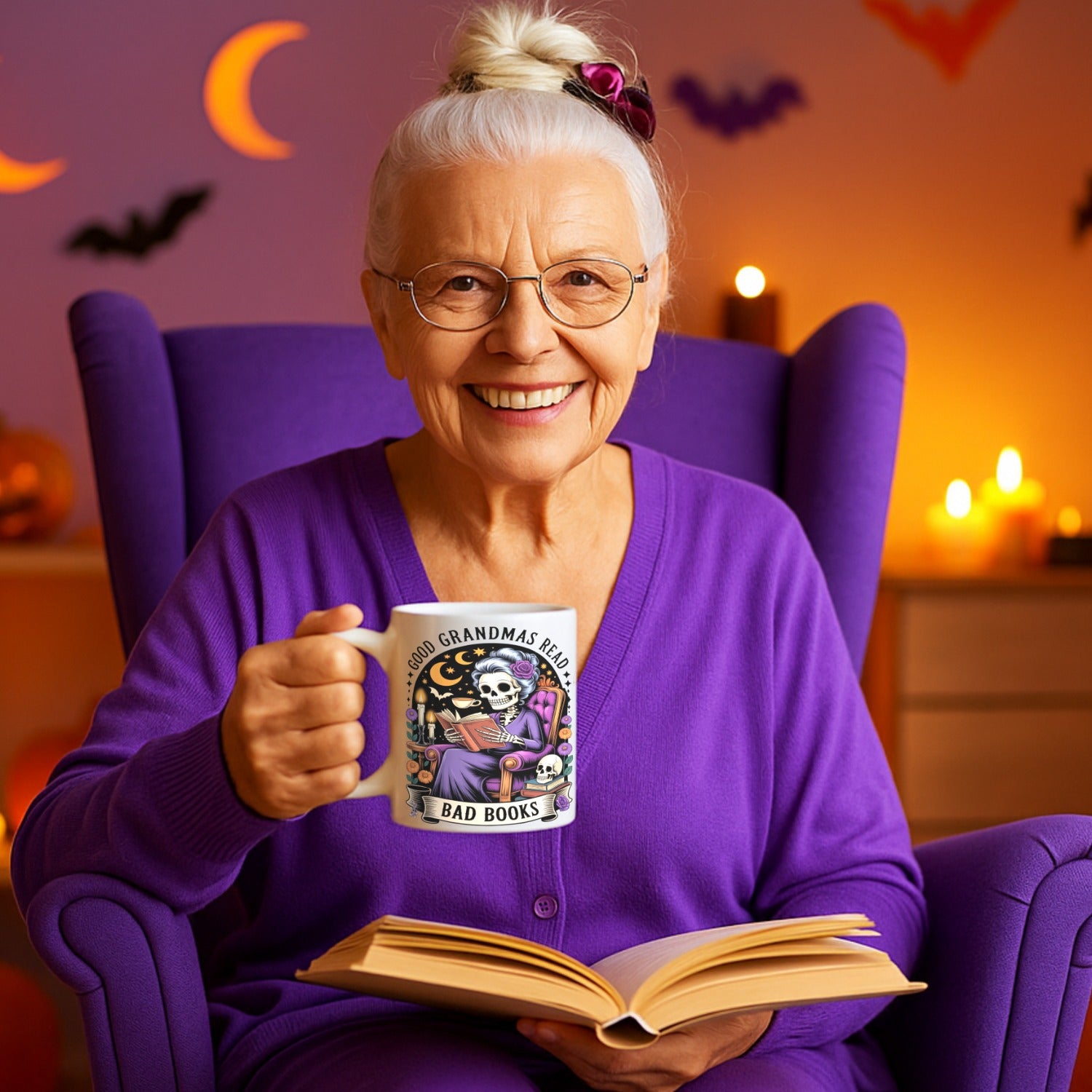 Woman in a chair holding a Good Grandmas Read Bad Books mug – funny gothic coffee cup for book lovers