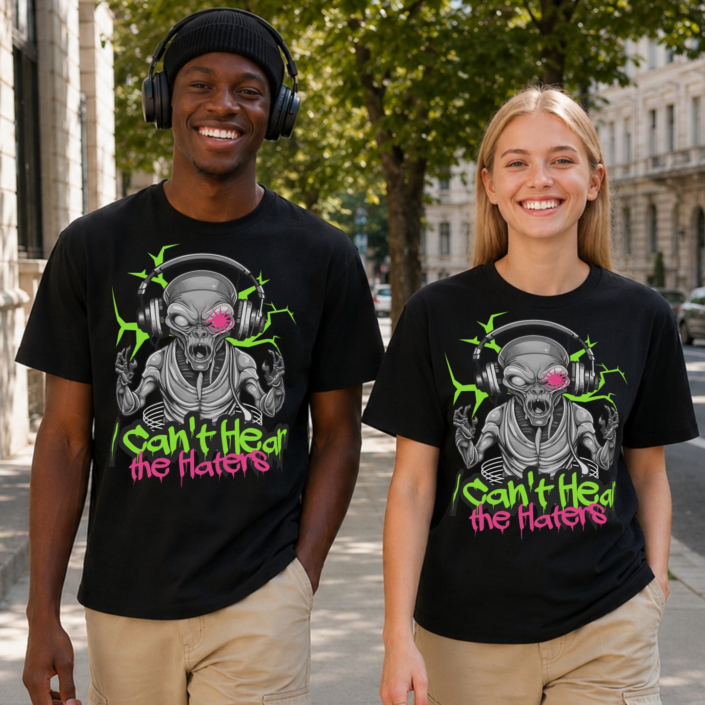 Two people wearing black I Can't Hear The Haters t-shirts featuring a neon alien with headphones design, funny alien graphic tee and urban streetwear t-shirt.