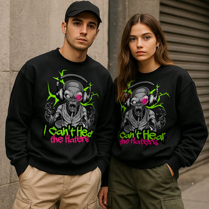 Two people wearing black sweatshirts with a alien graphic design and text that says I cant hear the haters