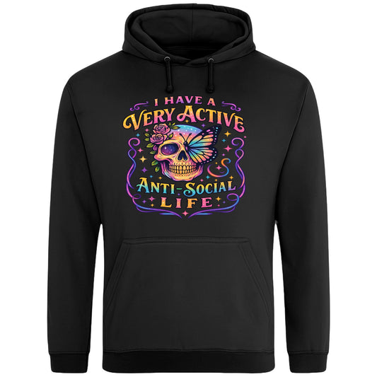 Black hoodie with “I Have a Very Active Anti-Social Life” print with a colourful skull, rose, and butterfly graphic — bold streetwear for cosy anti-social vibes.
