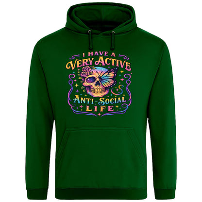 Rainforest Green hoodie with “I Have a Very Active Anti-Social Life” print with a colourful skull, rose, and butterfly graphic — bold streetwear for cosy anti-social vibes.