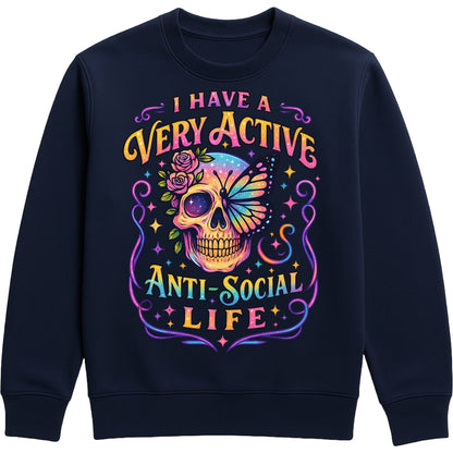 I Have A Very Active Anti Social Life sweatshirt featuring a colourful neon sugar skull, butterfly, and floral graphic on a navy unisex graphic sweatshirt, perfect for introverts who love sarcastic humour, alternative fashion, and cosy everyday style.