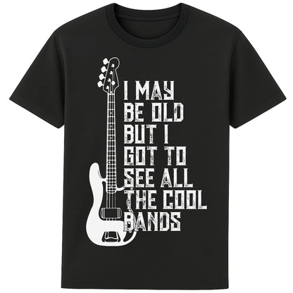 A black colour unisex t-shirt featuring distressed text "I May Be Old But I Saw All the Cool Bands" with a vintage electric bass guitar graphic, perfect for music lovers and retro style fans
