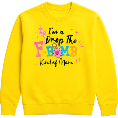funny yellow motherhood sweatshirt featuring "I'm A Drop The F-Bomb Kind Of Mom" slogan in colourful retro lettering and floral graphics.
