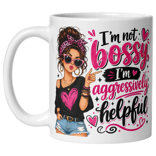 White ceramic coffee mug featuring the funny "I'm Not Bossy, I'm Aggressively Helpful" quote with a stylish fashion illustration of a confident woman wearing sunglasses, a pink headband, and a black heart top.
