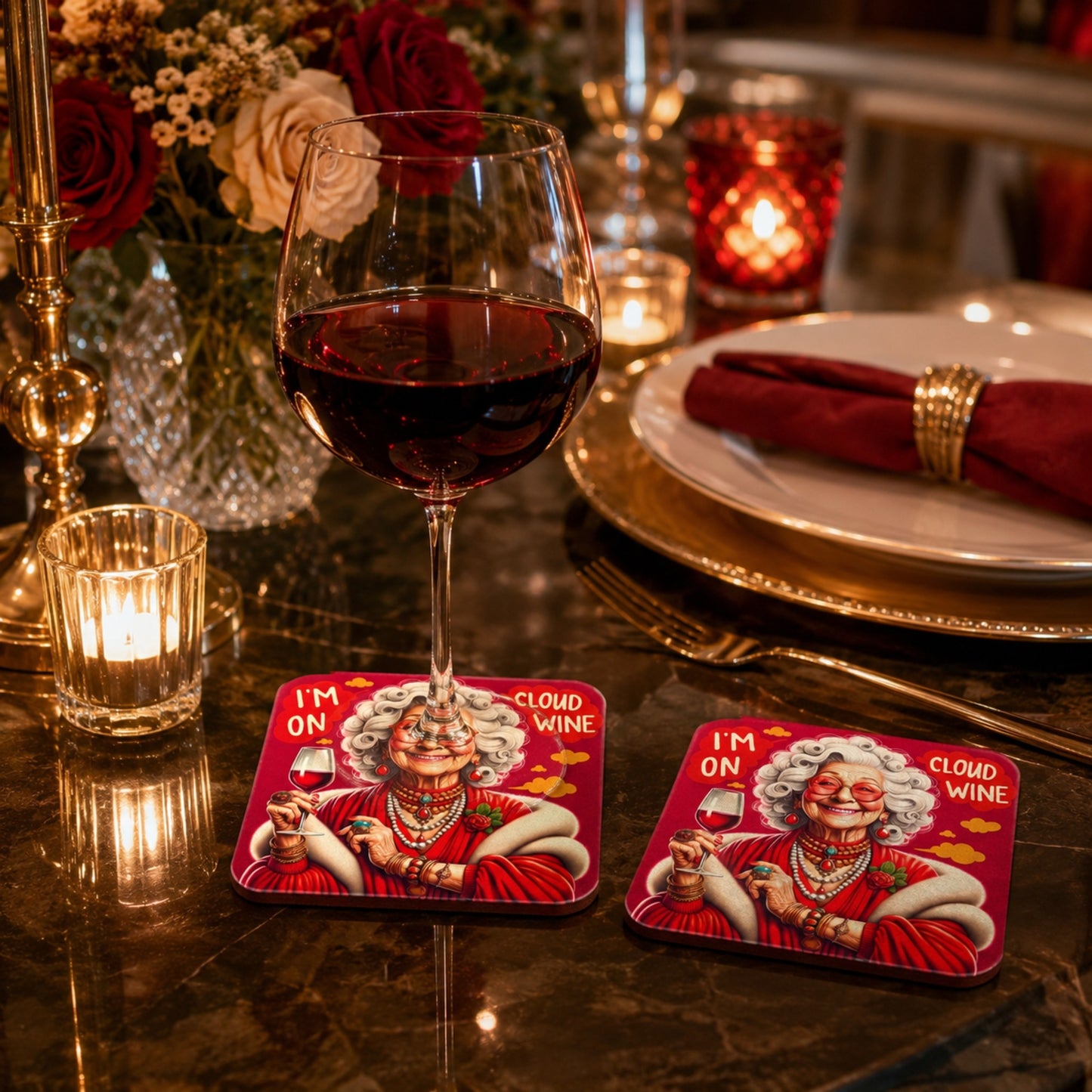 Luxury lifestyle mockup of the I'm On Cloud Wine coaster on an elegant dinner table with a glass of red wine resting on the coaster and a matching coaster beside it, surrounded by candles, flowers, and sophisticated table décor.