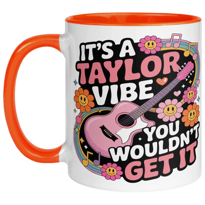 It's A Taylor Vibe You Wouldn't Get It retro music coffee mug with a colourful guitar, flowers, rainbow accents, musical notes, and playful typography, featuring a orange handle and interior for pop music lovers.
