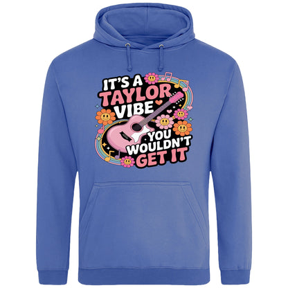 Bright royal blue colour It's A Taylor Vibe You Wouldn't Get It retro music fan hoodie in pink featuring a colourful guitar, flowers, rainbow accents, musical notes, and playful typography for pop music lovers and concert fans.