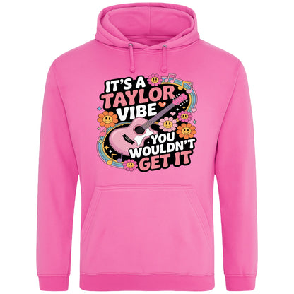 Candyfloss pink colour It's A Taylor Vibe You Wouldn't Get It retro music fan hoodie in pink featuring a colourful guitar, flowers, rainbow accents, musical notes, and playful typography for pop music lovers and concert fans.