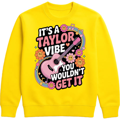 Cosy yellow It's A Taylor Vibe You Wouldn't Get It retro music fan sweatshirt in pink featuring a colourful guitar, flowers, rainbow accents, musical notes, and playful typography for pop music lovers and concert fans.