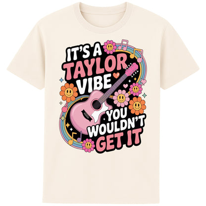 Naturel colour It's A Taylor Vibe You Wouldn't Get It retro pop music graphic T-shirt in yellow featuring a pink guitar, colourful flowers, music notes, hearts, and playful typography for Taylor-inspired music fans.