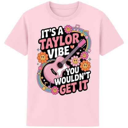Pink retro It's A Taylor Vibe You Wouldn't Get It retro pop music graphic T-shirt in yellow featuring a pink guitar, colourful flowers, music notes, hearts, and playful typography for Taylor-inspired music fans.