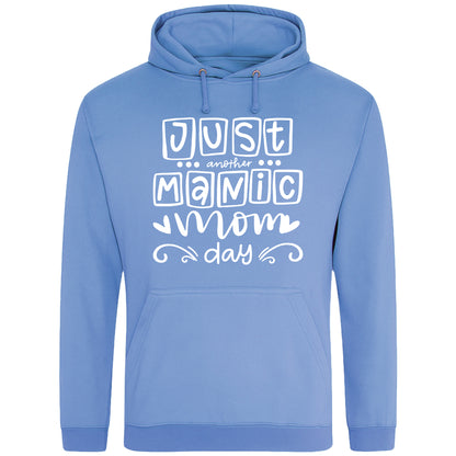 A cornflower blue hoodie with 'Just Another Manic Mom Day' printed on the front, styled for casual everyday wear, perfect for moms balancing busy lives.