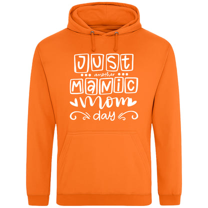 A orange hoodie with 'Just Another Manic Mom Day' printed on the front, styled for casual everyday wear, perfect for moms balancing busy lives.