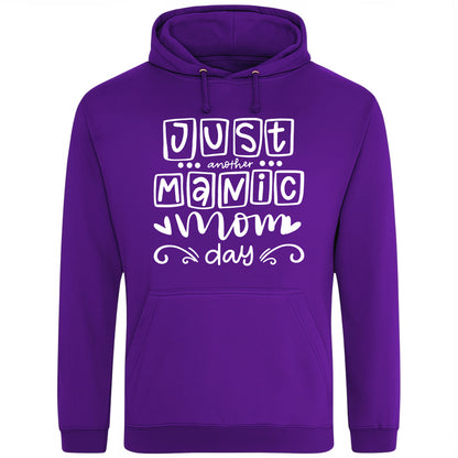 A purple hoodie with 'Just Another Manic Mom Day' printed on the front, styled for casual everyday wear, perfect for moms balancing busy lives.