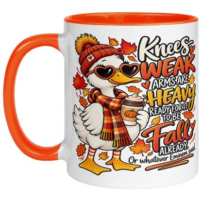 Knees Weak Arms Are Heavy funny autumn mug with cosy goose artwork, fall leaves, orange handle and orange interior pumpkin spice coffee.