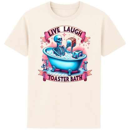 Live Laugh Toaster Bath funny dark humour skeleton t-shirt featuring a colourful skeleton relaxing in a bubble bath with a toaster beneath a parody Live Laugh slogan on a unisex naturel colour tee
