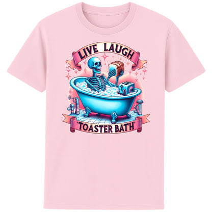 Live Laugh Toaster Bath funny dark humour skeleton t-shirt featuring a colourful skeleton relaxing in a bubble bath with a toaster beneath a parody Live Laugh slogan on a unisex pink tee