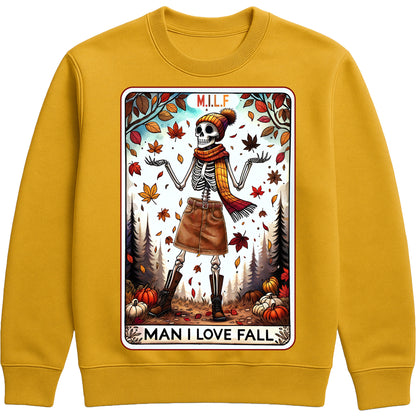 A cozy graphic gold colour sweatshirt featuring a cute skeleton with fall accessories and the phrase “M.I.L.F. – Man I Love Fall,” surrounded by pumpkins and autumn elements.